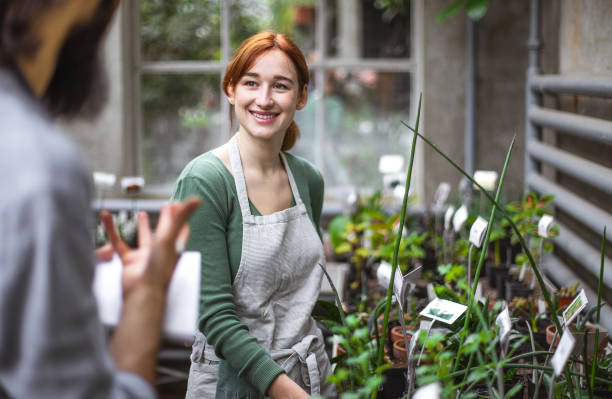 istock Two People working at the botanical garden 1264247124