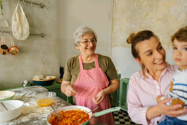 istock Senior woman making pasta in the kitchen 1264248585