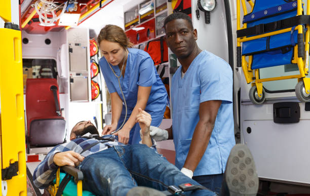 istock Paramedic team moving man on stretcher 1264249071