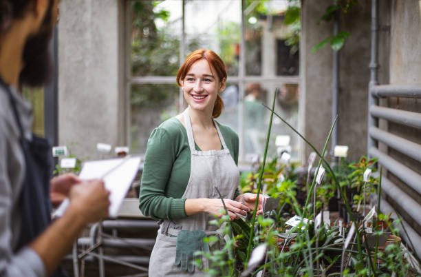 istock Two People working at the botanical garden 1264250318