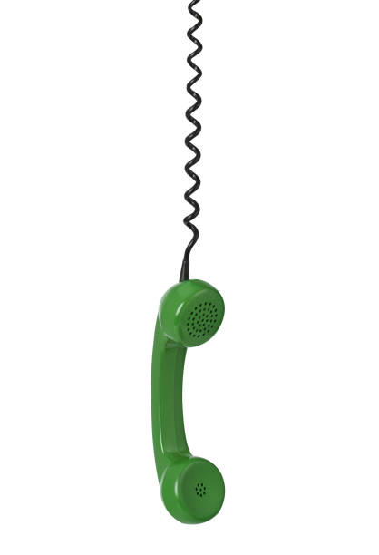 Telephone receiver and cord isolated on white