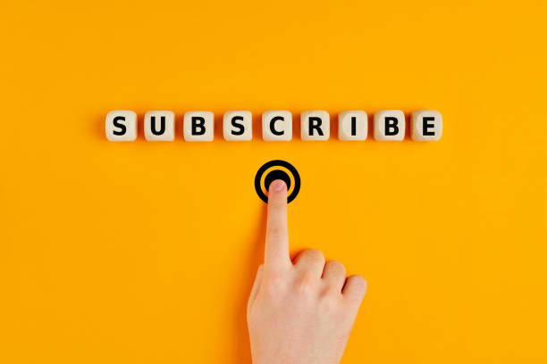 Male hand pressing subscription button with the word subscribe written on wooden blocks. Concept of online registration. Male hand pressing subscription button with the word subscribe written on wooden blocks. Online registration concept. newsletter stock pictures, royalty-free photos & images