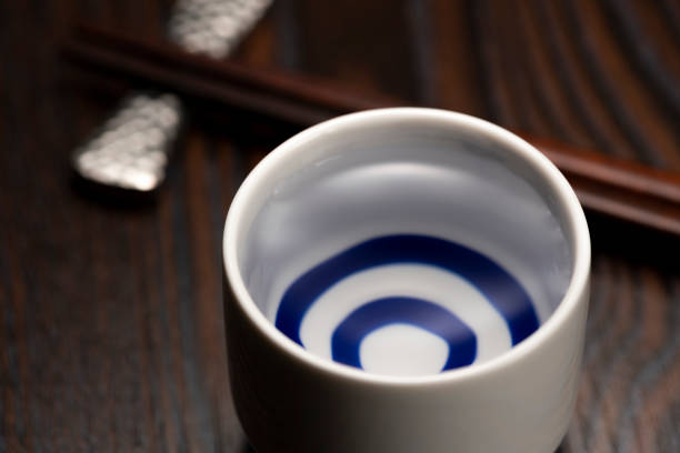 istock Cold sake with rice and ear of rice on the table 1264257954