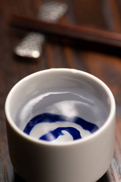 istock Cold sake with rice and ear of rice on the table 1264258024