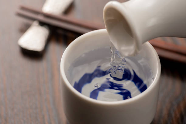 istock Cold sake with rice and ear of rice on the table 1264258044