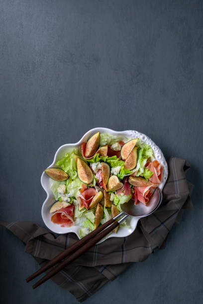 Salad with figs, prosciutto and blue cheese Salad with figs, prosciutto and blue cheese plate fig blue cheese cheese stock pictures, royalty-free photos & images