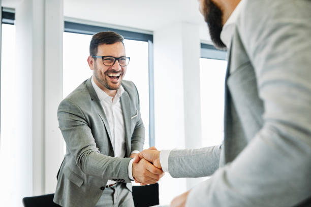 istock business man office work hand shaking meeting agreement offer handshake greeting introducing office 1264268352