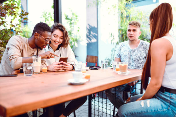 istock Multiethnic Friends Enjoying Time Together With Refreshment In Coffee Bar 1264268659
