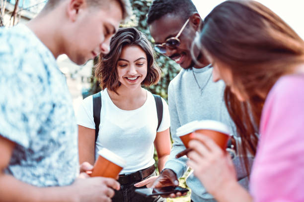 istock Happy Friends Checking New Smartphone Apps And Enjoying Coffee 1264268699