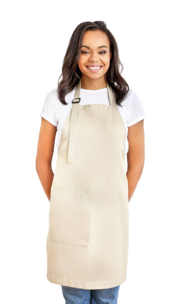Smiling young african woman in apron Smiling young african woman in apron isolated on white background. Restaurant worker. Delivery service. waiter photos stock pictures, royalty-free photos & images