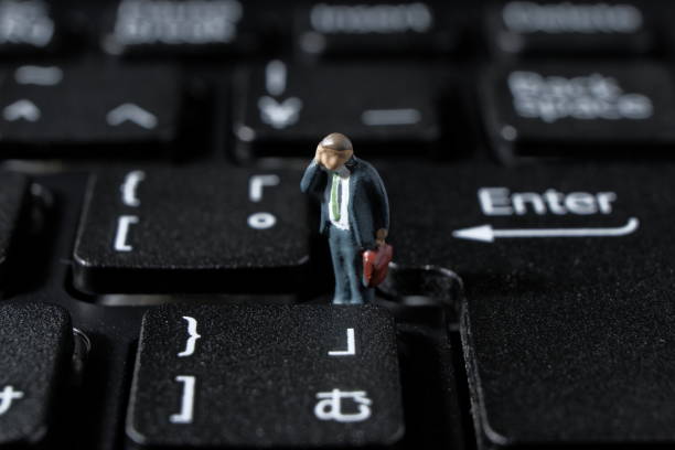 istock a businessman who wipes sweat off his keyboard 1264279011