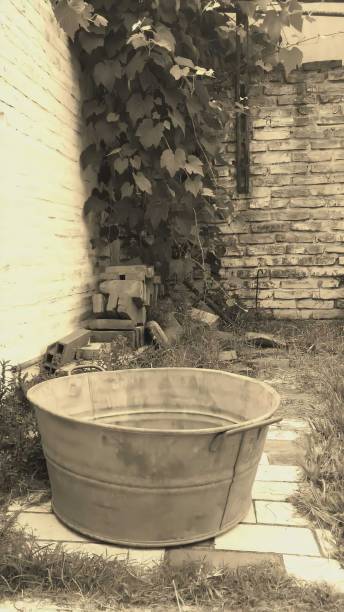 istock Old countryside scene with brass basin 1264279097