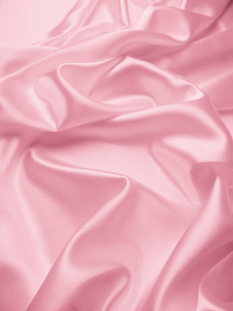 istock Beautiful elegant wavy light pink satin silk 1264280354