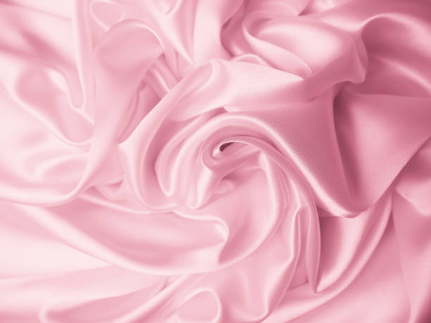 istock Beautiful elegant wavy light pink satin silk 1264280376
