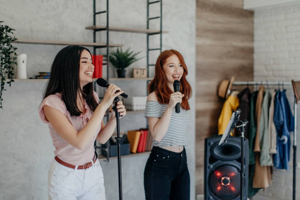 istock Female karaoke slumber party 1264282254