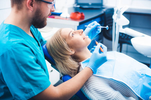 istock Dentist treating girl 1264282986