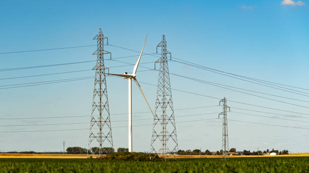 istock Wind turbine and high voltage power lines 1264284857