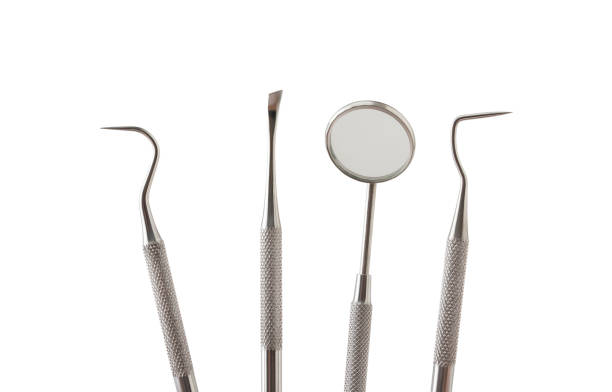 istock Metal dental tools on a white background 1264285045
