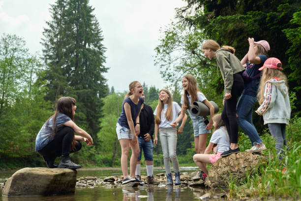 istock Teenage friends having fun on river beach. 1264286681