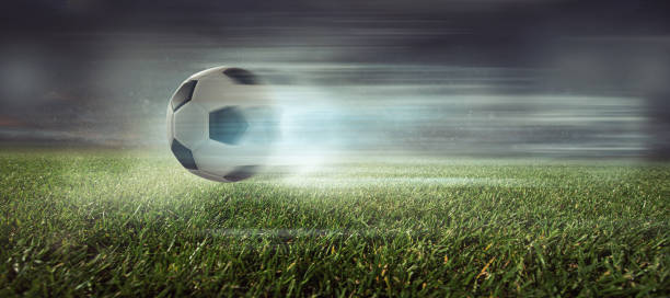 istock Soccer ball in a stadium 1264288546
