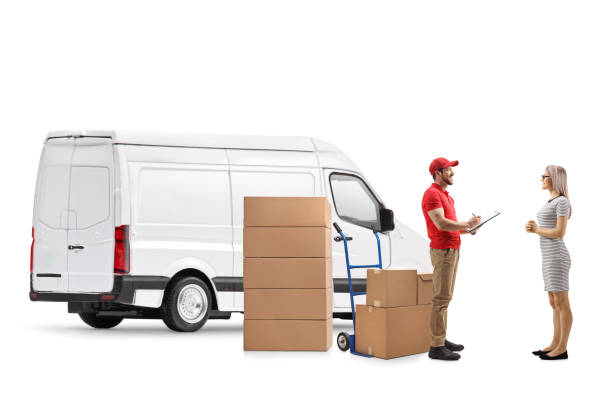 Delivery man with a van delivering boxes to a young woman Delivery man with a van delivering boxes to a young woman isolated on white background mover delivery person box hand truck stock pictures, royalty-free photos & images