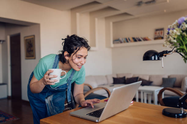 Young woman working online from home stock photo