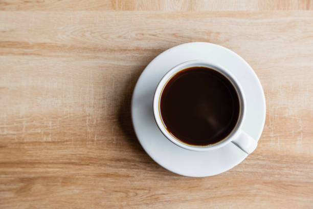 istock Coffee cups on wooden table 1264291827