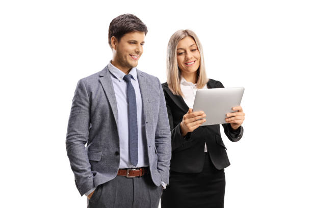 istock Professional young man and woman looking at a digital tablet 1264292374