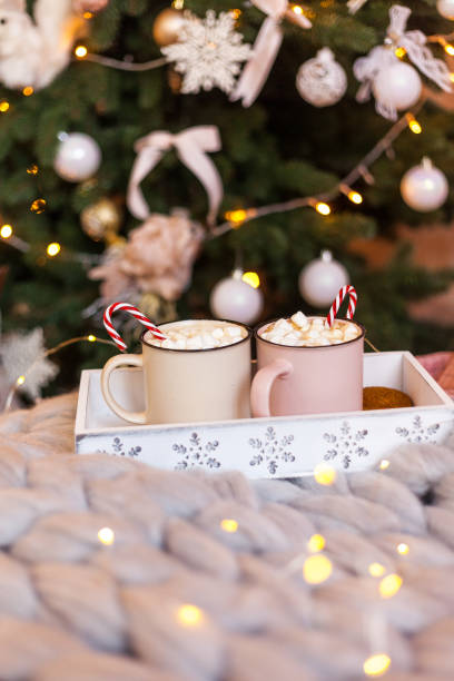 istock Two cups with cappuccino, a festive box with a gift, Christmas decorations 1264294923