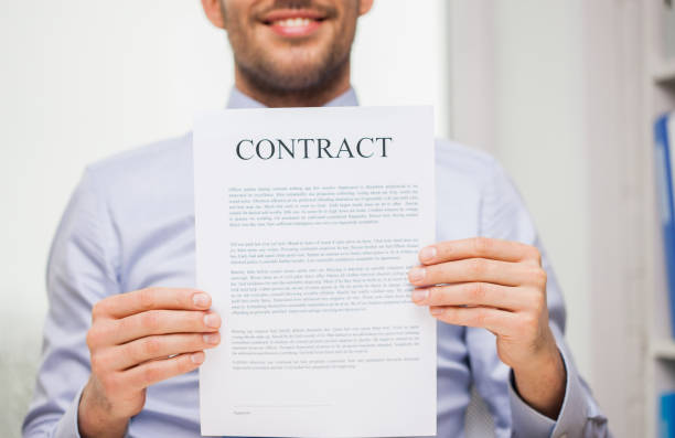 istock close up of businessman holding contract document 1264295492