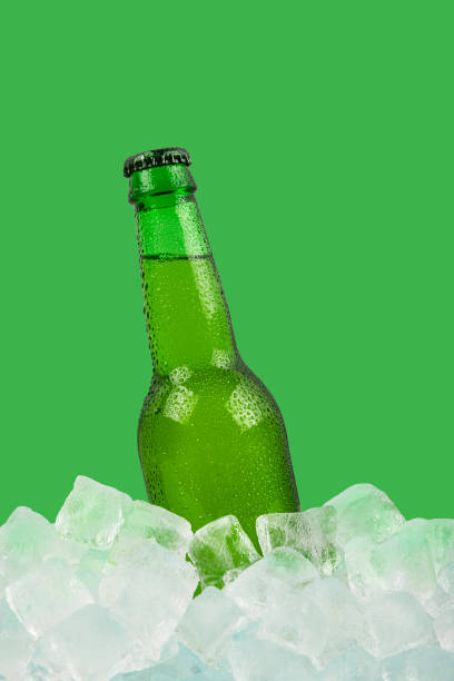 istock One bottle of cold lager beer on ice cubes 1264298608