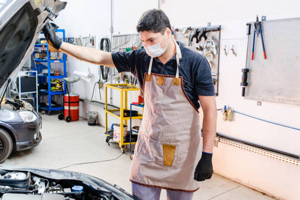 istock Portrait of mechanic using mask 1264299005