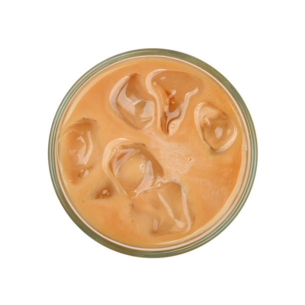 Glass of coffee with milk and ice Close up one big glass of coffee with milk and ice cubes isolated on white background, elevated top view, directly above iced coffee stock pictures, royalty-free photos & images