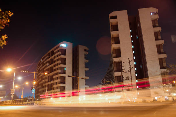 Timelaps image of cars moving on the road and cityscape