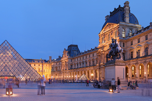 France, Paris - May 6, 2011: Night time view of the Louvre Museum and the I. M. Pei designed Louvre pyramid.