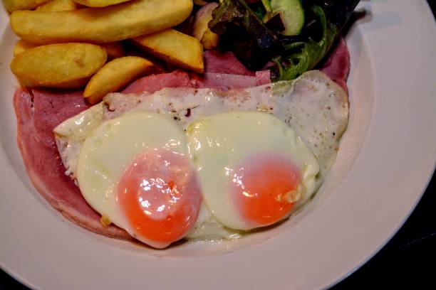 istock HONEY AND MUSTARD ROASTED HAM
WITH FRIED EGGS, CHIPS AND SALAD GARNISH 1264306491