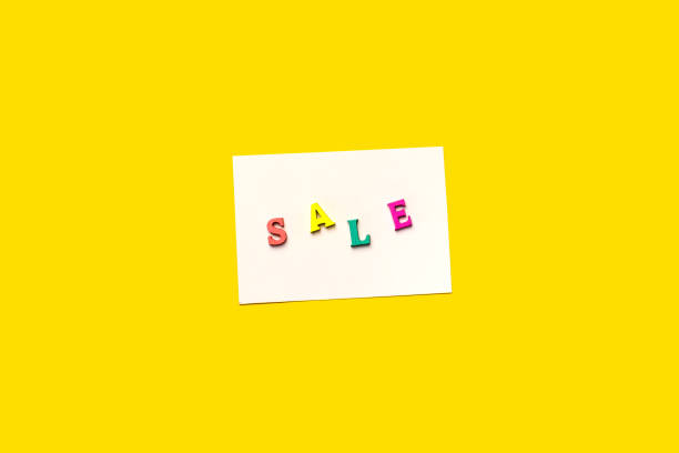 istock Sale text write on white card isolated on Yellow background 1264307936