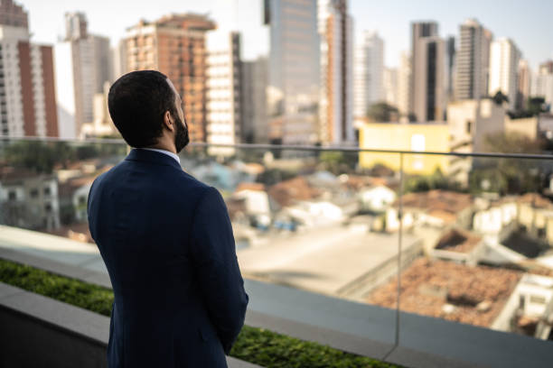 istock Thoughtful businessman looking away 1264308353