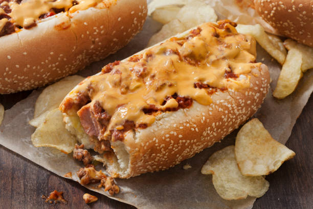 istock Chili Dog with Cheese Sauce and Potato Chips 1264309800