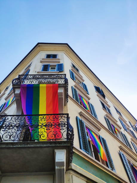 istock Rainbow flag hanging on building under the window 1264311206