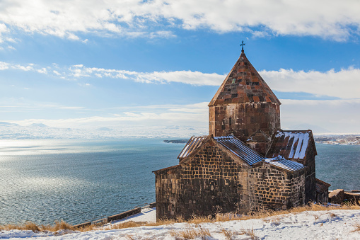 Sevanavank, church on the background of Lake Sevan. Winter