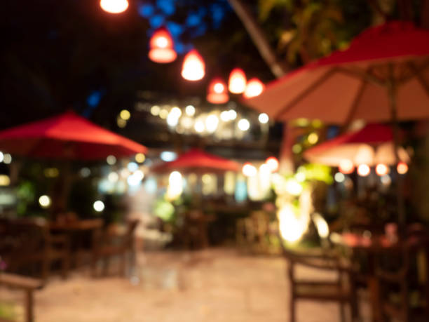 blur and bokeh of beach bar restaurant for background. samed, thailand. - samed stock-fotos und bilder
