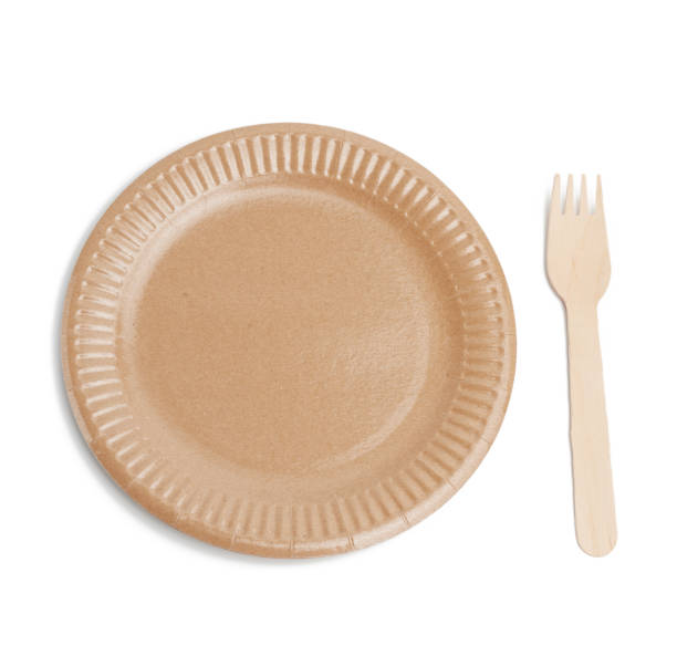 istock wooden fork and empty round brown disposable plate made from recycled materials 1264314886