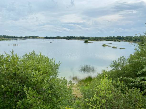 istock Old abandoned sand pit on a summer cloudy day 1264315238