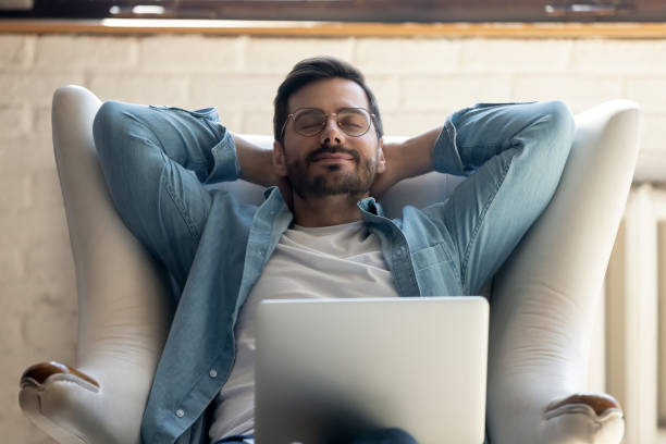 istock Young man rest in comfortable chair relaxing at home 1264315845