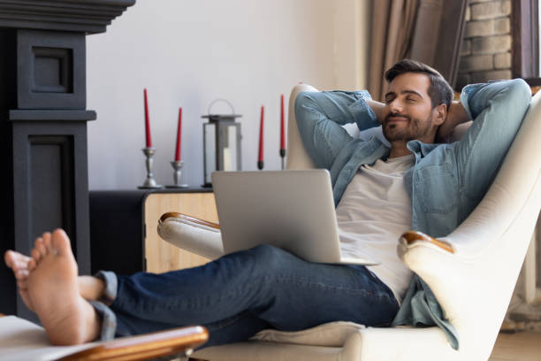 istock Millennial man relax in comfortable chair at home 1264315848