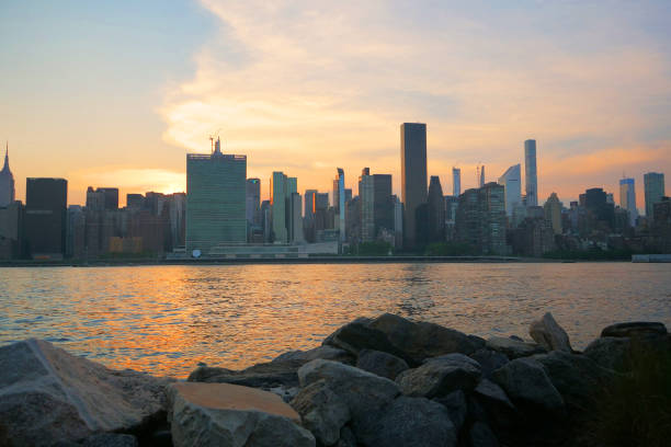 istock manhattan NYC skyline sunset light from back 1264316653