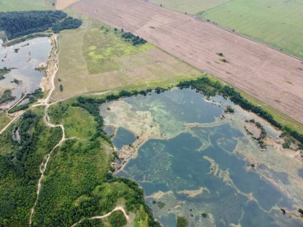 istock Old flooded sand pit aerial photo 1264318371