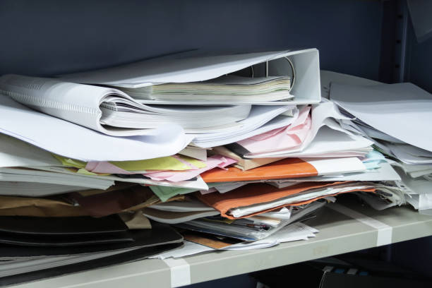 istock Messy file document and Office Supplies in filing cabinets at work office 1264321888