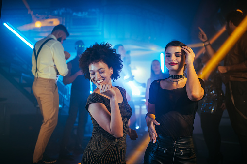 Two females enjoying a night out at a club
